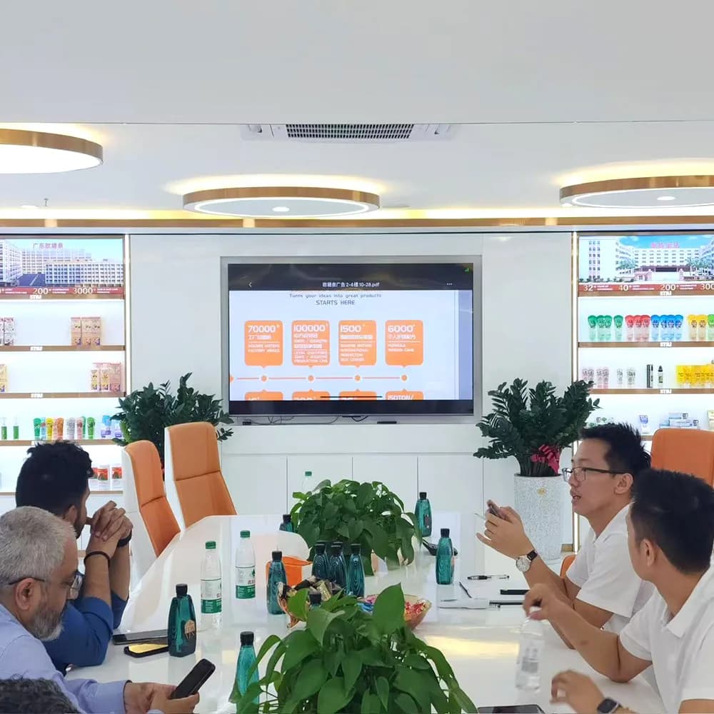 King Metis team discussing personal care product requirements with visiting buyers in the showroom