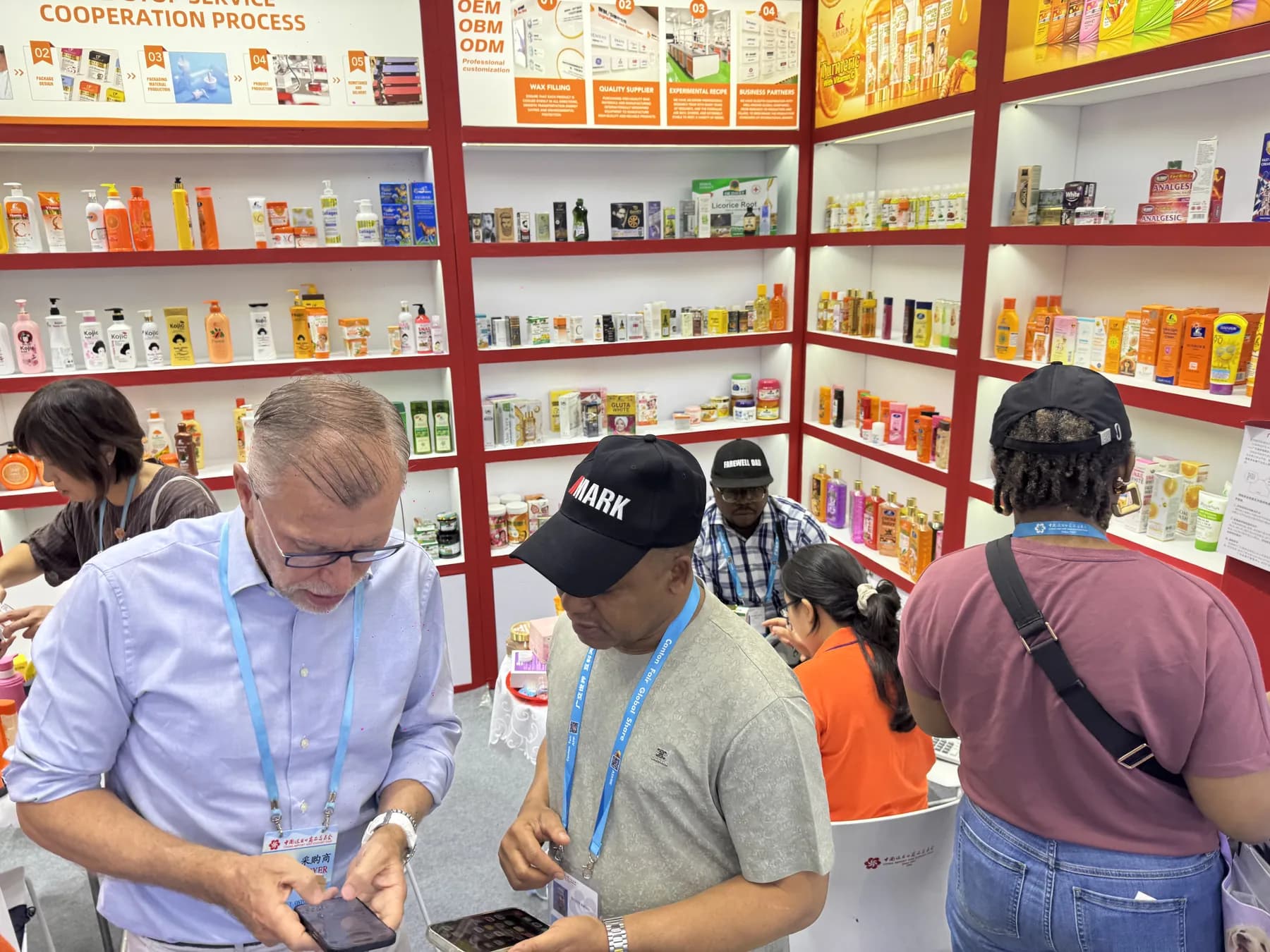 Buyers reviewing personal care product samples with the King Metis team